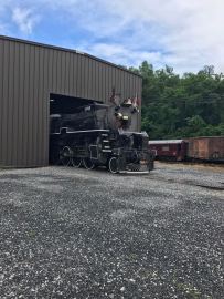 Moving the locomotive outside to be washed.
