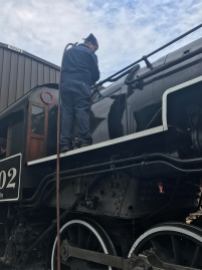 Marshal washing out the top of the crown sheet in the firebox.